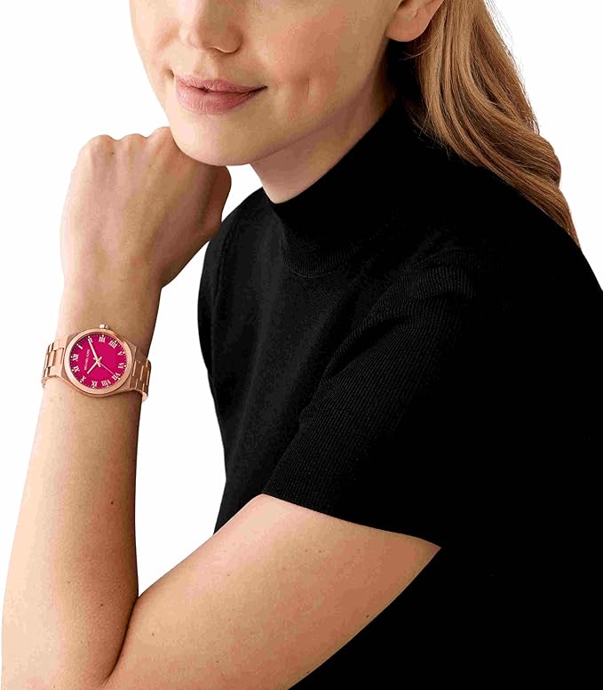 Michael Kors Lennox watch worn on wrist with pink dial and roman numerals