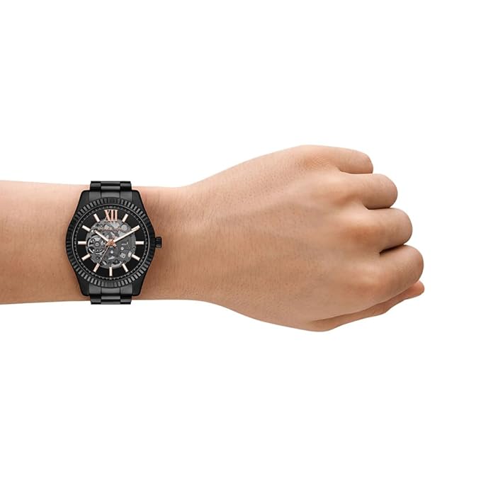 Michael Kors Lexington MK9244 men's watch on wrist displaying Roman numerals and bracelet