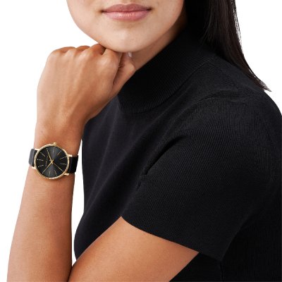 MK2747 Pyper watch worn on wrist with black dial and gold-tone case