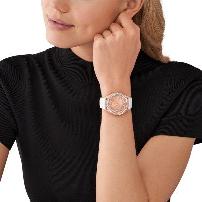 Michael Kors MK2989 Harlowe watch worn on wrist showing rose gold case and white strap