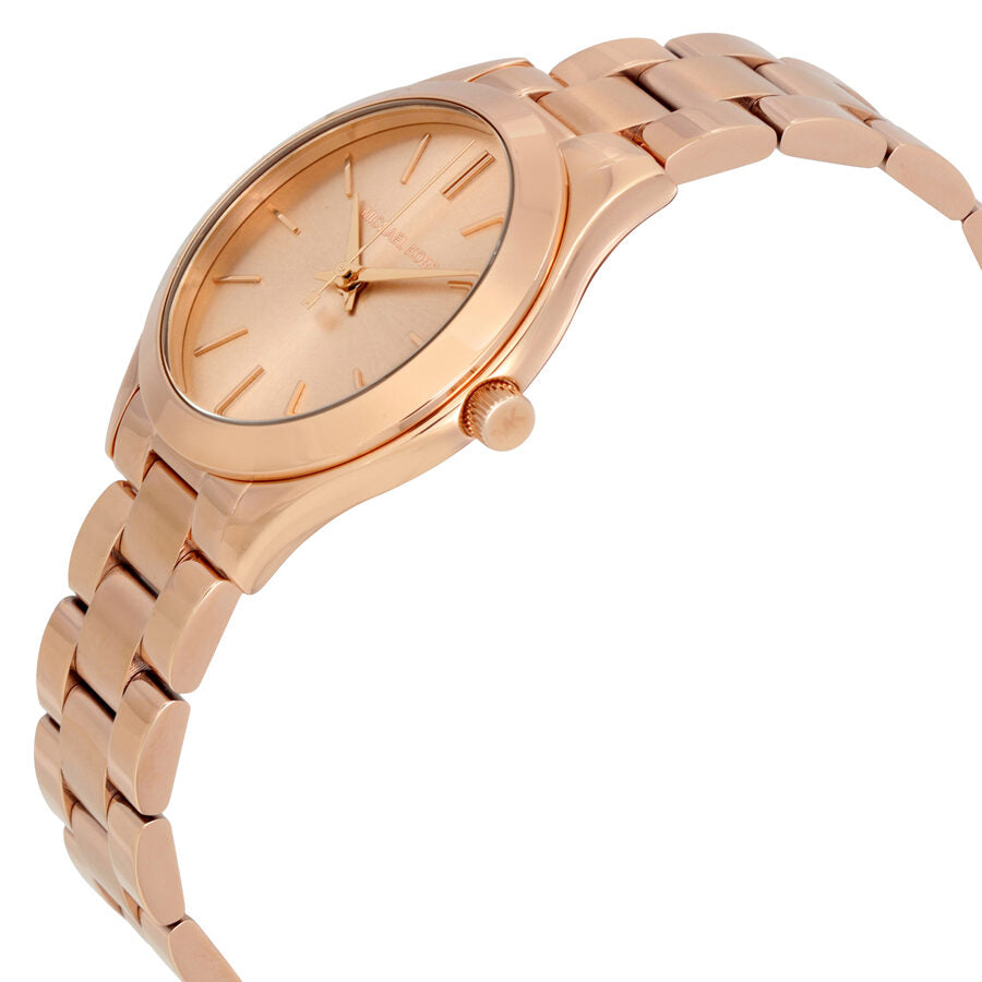 Side angle view of Michael Kors Mini Slim Runway rose-gold watch showing case and tapered bracelet