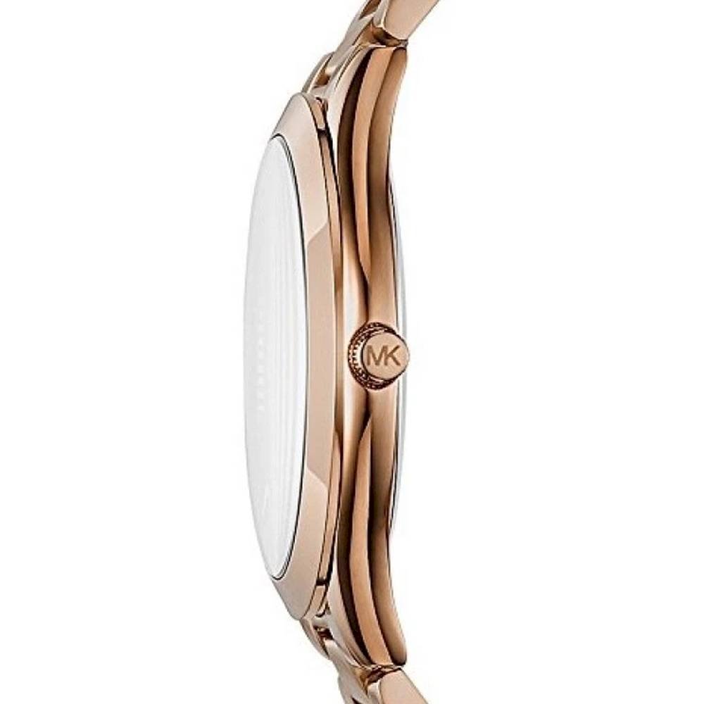 Michael Kors rose gold women's watch side profile showing slim case and metal band with MK charm