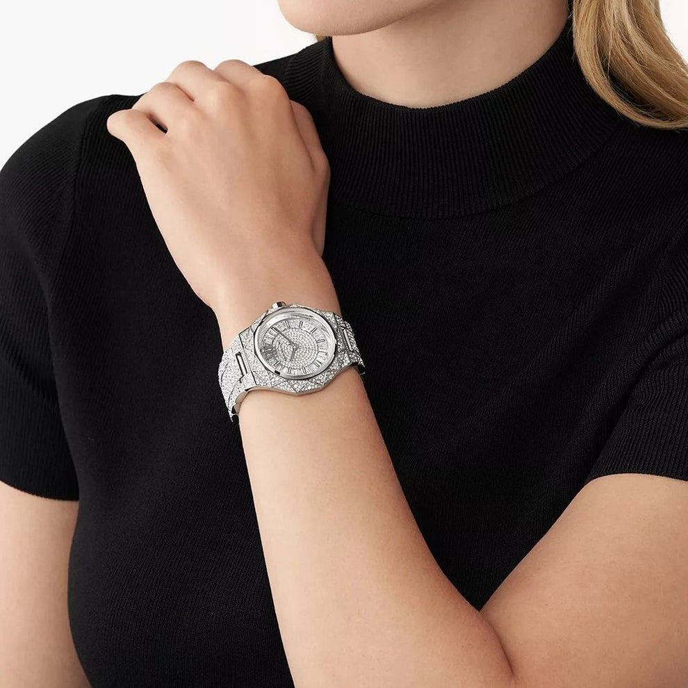 Michael Kors Raquel Pavé silver women's watch on wrist with black sleeve