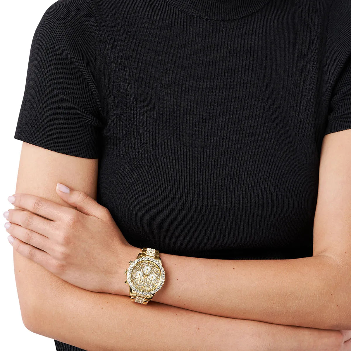 MK6977 gold ladies watch worn on wrist with crystal dial and bezel