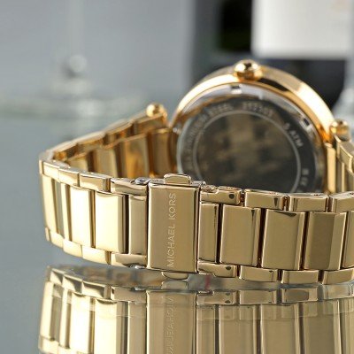 Michael Kors MK7283 Parker watch side view showing gold bracelet strap and caseback