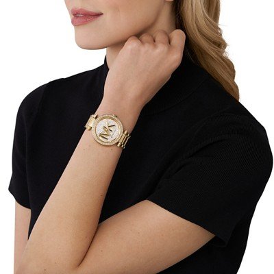 Michael Kors MK7283 Parker watch worn on wrist with crystal-embellished gold case