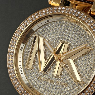 Close-up of MK7283 Parker dial with pave crystals, gold MK logo, and hour markers