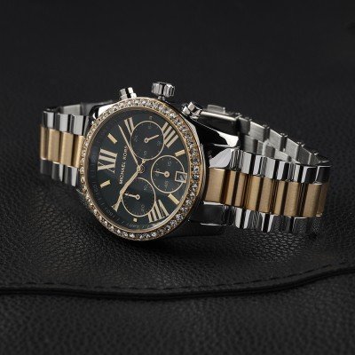 Michael Kors MK7303 Lexington watch angled view showing two-tone stainless steel and gold bracelet