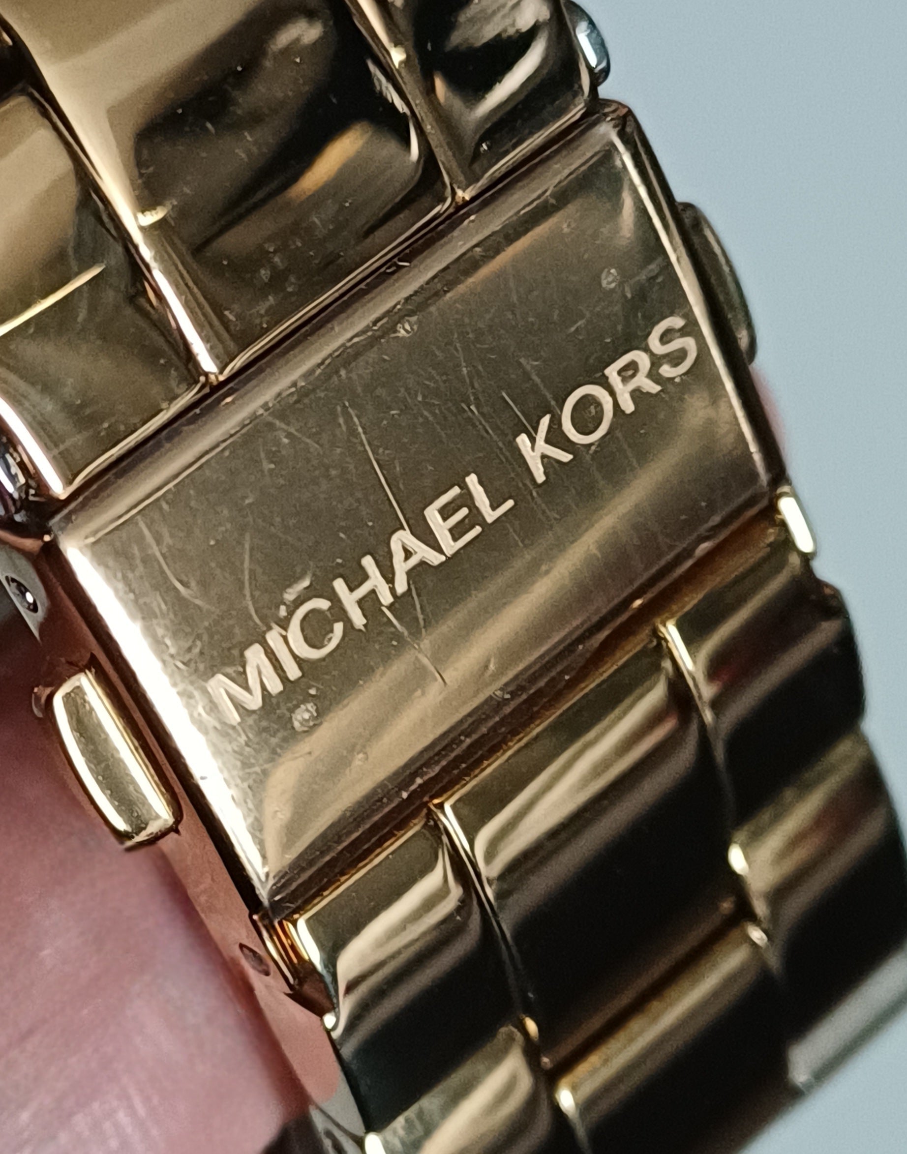 Michael Kors engraved metal bracelet link detail