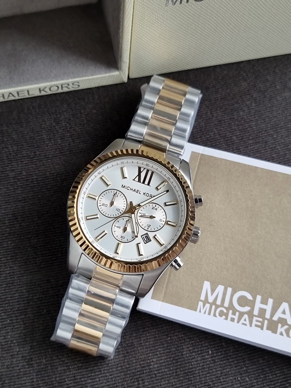 Michael Kors MK9236 chronograph watch at angle with two-tone bracelet
