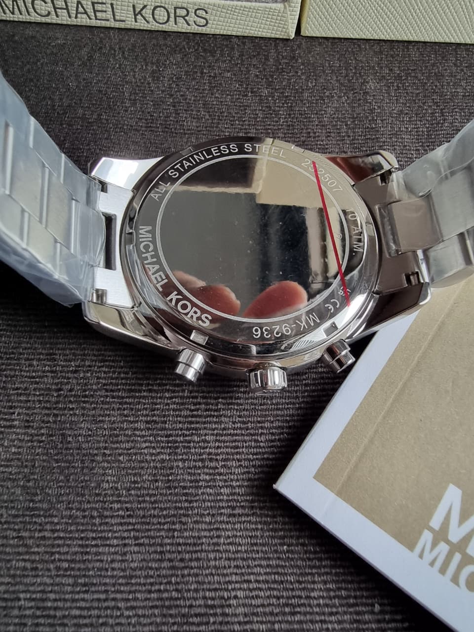 Michael Kors MK9236 stainless steel caseback with engraved text