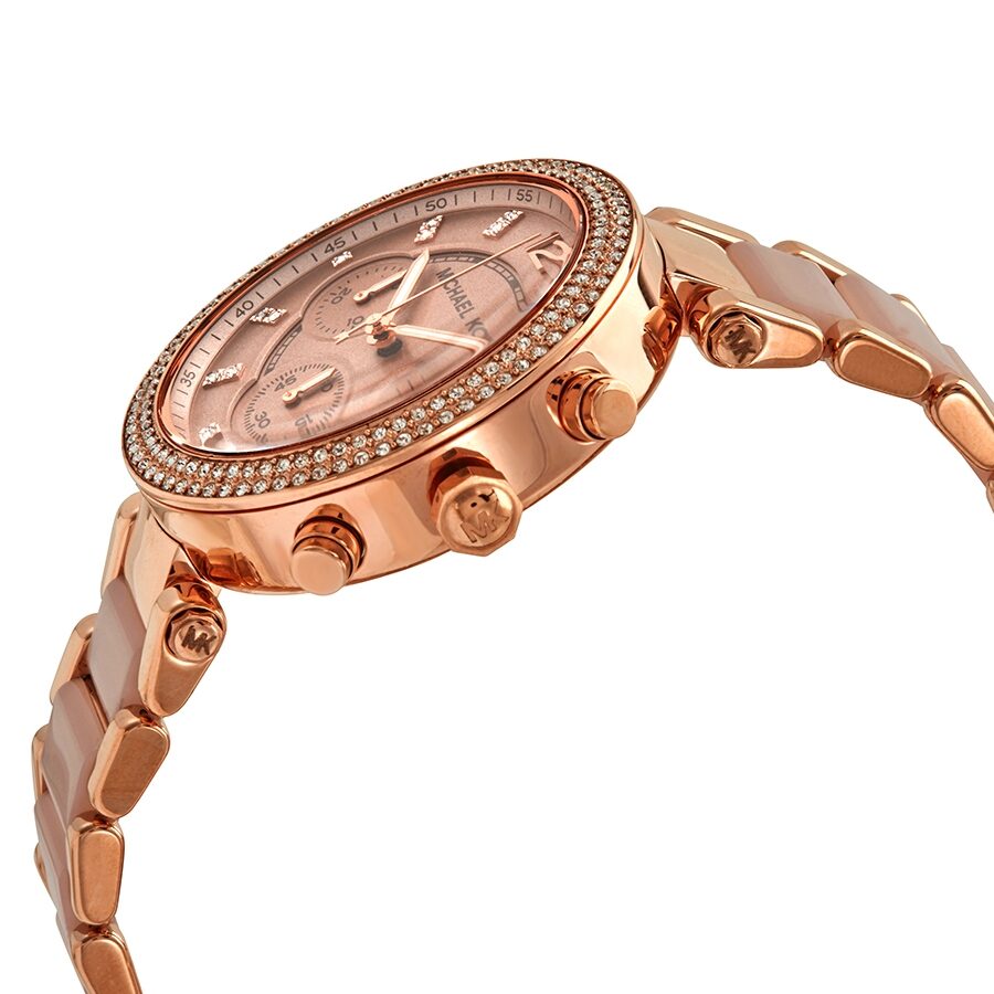 Side angle view of Michael Kors Parker watch showing rose gold case, chronograph subdials, and blush ceramic strap