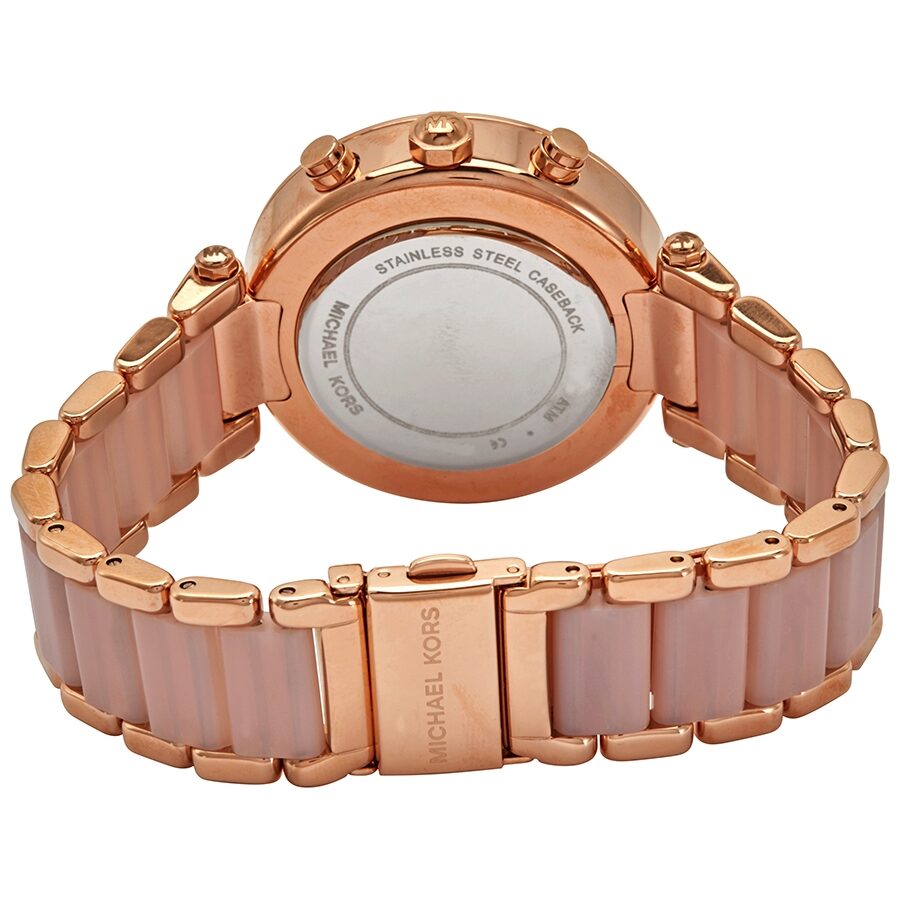 Michael Kors Parker watch caseback showing stainless steel case and blush ceramic bracelet link design