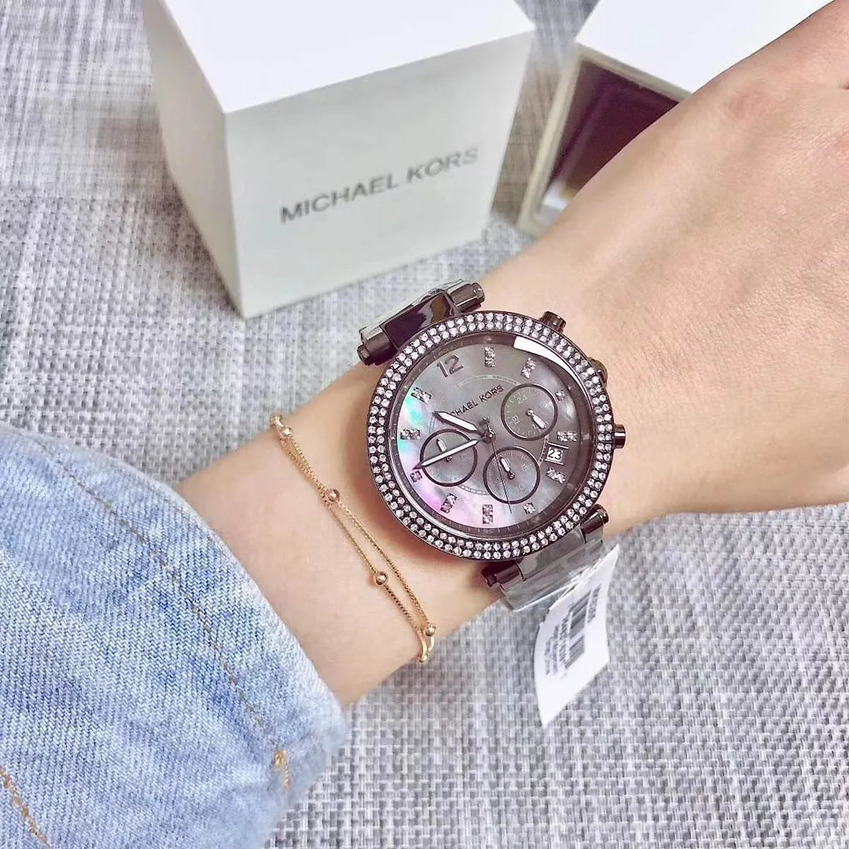 Michael Kors Parker MK6265 women's watch on wrist with Michael Kors box visible