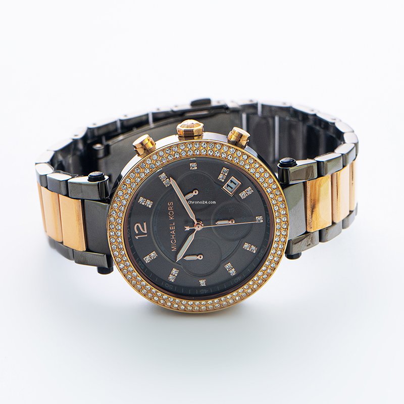 Michael Kors Parker women's watch angled view showing two-tone rose gold and gunmetal bracelet with chronograph dial