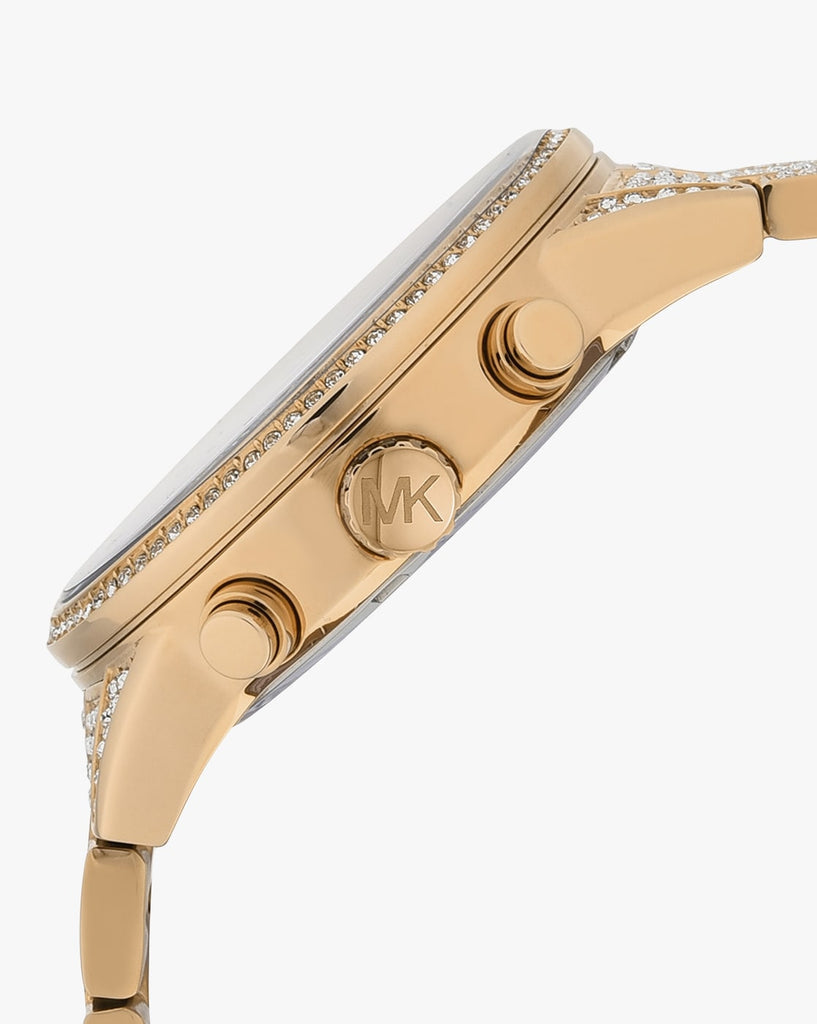 Side view of gold-tone watch case with pushers and MK logo engraving