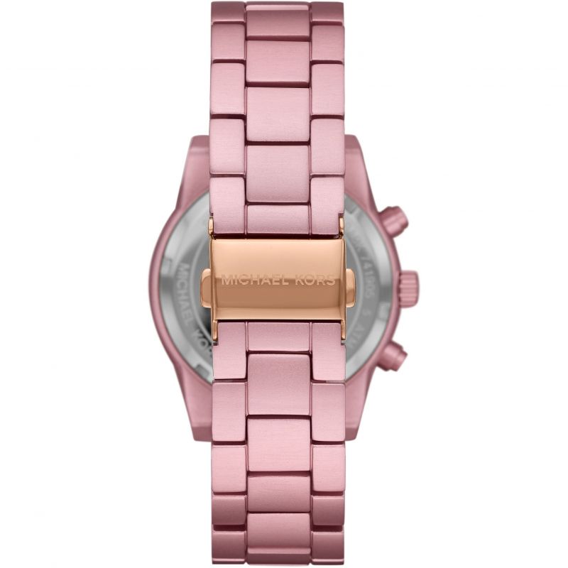 Case back of Michael Kors Ritz MK6753 with gold-tone plate and pink bracelet