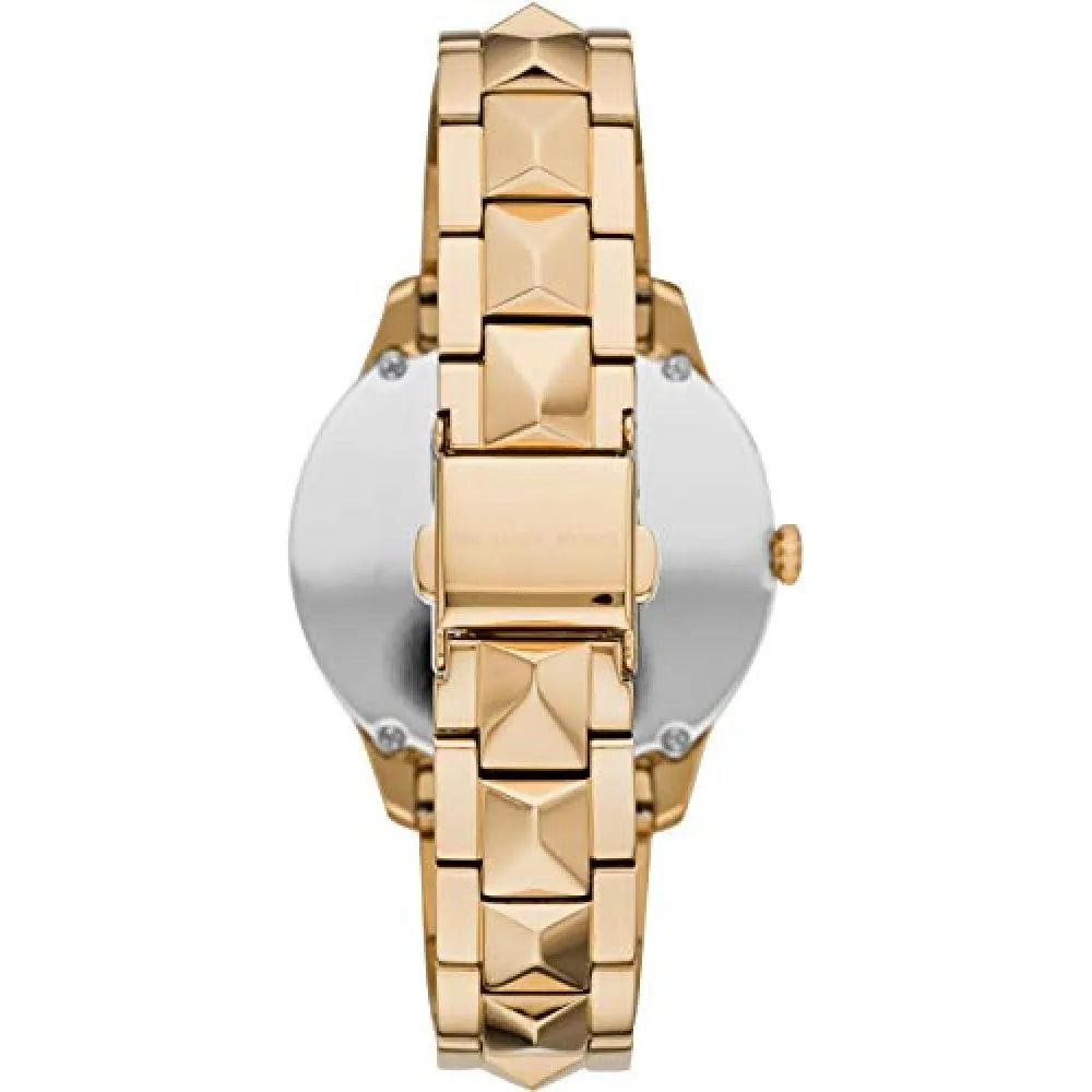 Caseback view of Michael Kors Runway Mercer watch showing stainless steel back plate