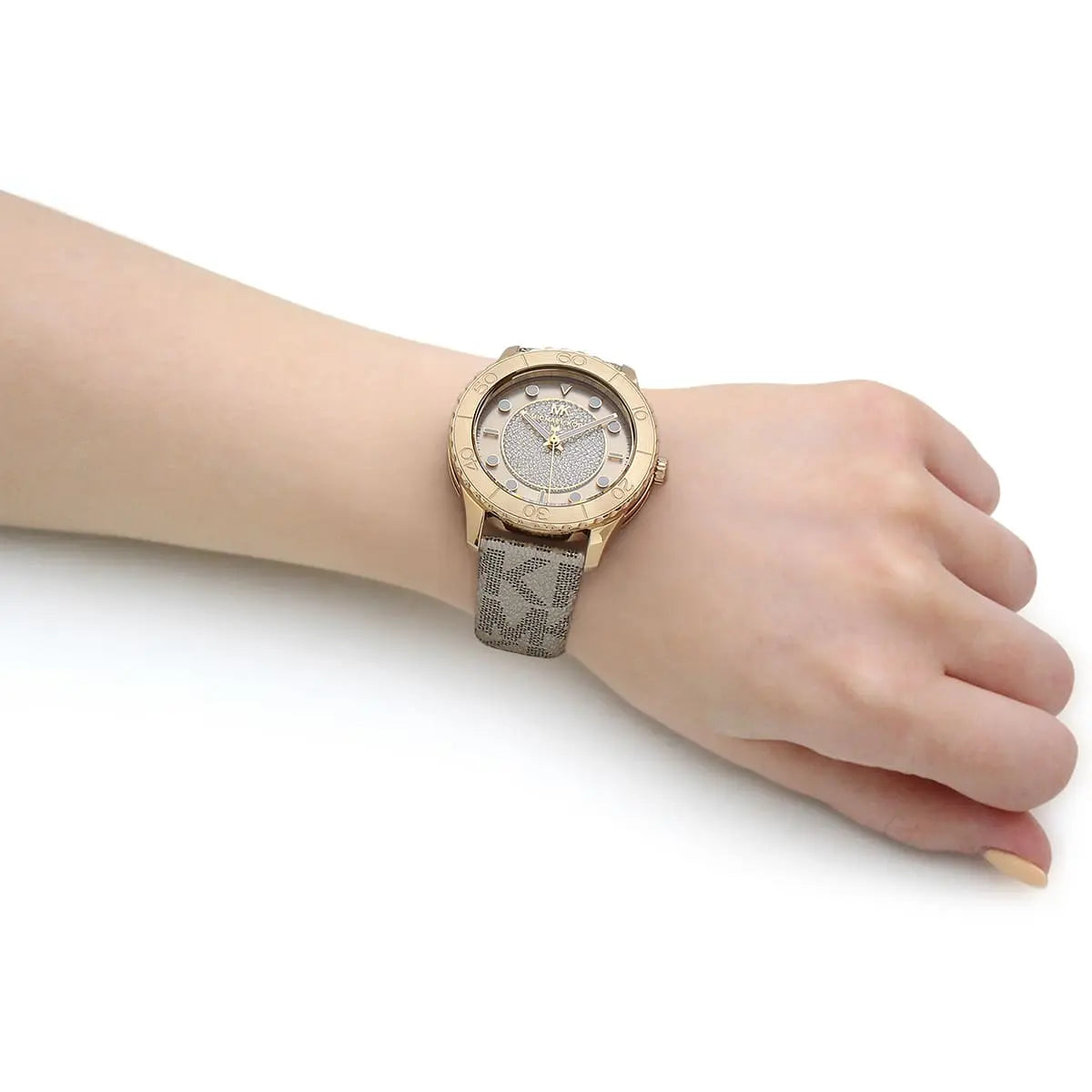 Michael Kors Runway MK6999 women's watch on wrist with gold-tone case