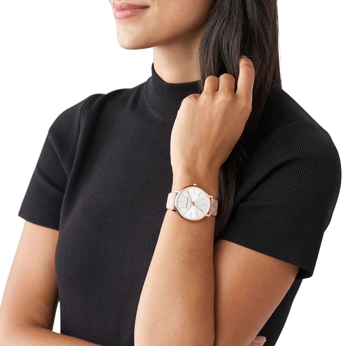 Michael Kors Pyper watch worn on wrist, showing silver dial and pink leather strap