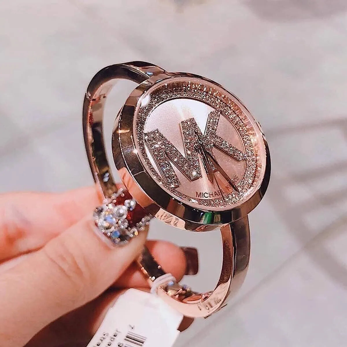 Michael Kors Blakley rose gold watch with crystal detail band on wrist