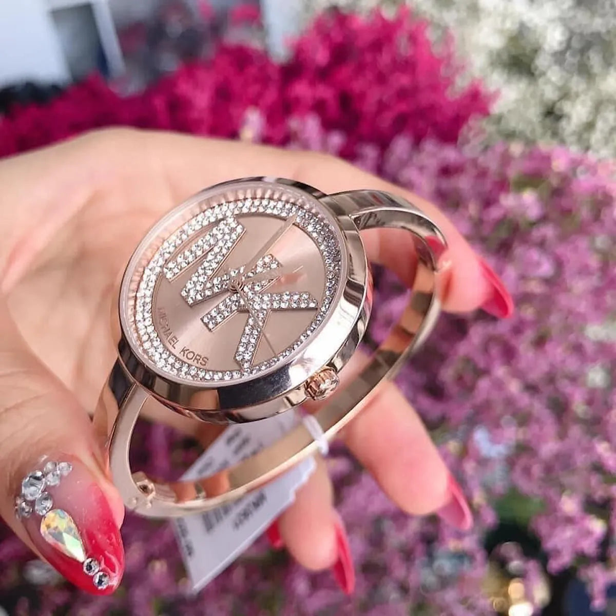 Michael Kors Blakley watch worn on wrist showing crystal bezel and rose gold case