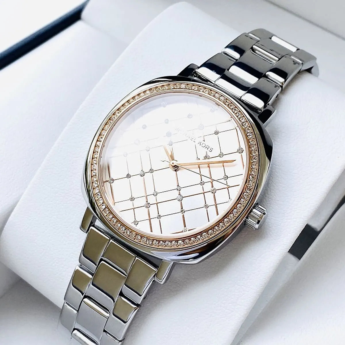 Michael Kors Nia watch on-wrist display with silver quilted dial and rose gold accents