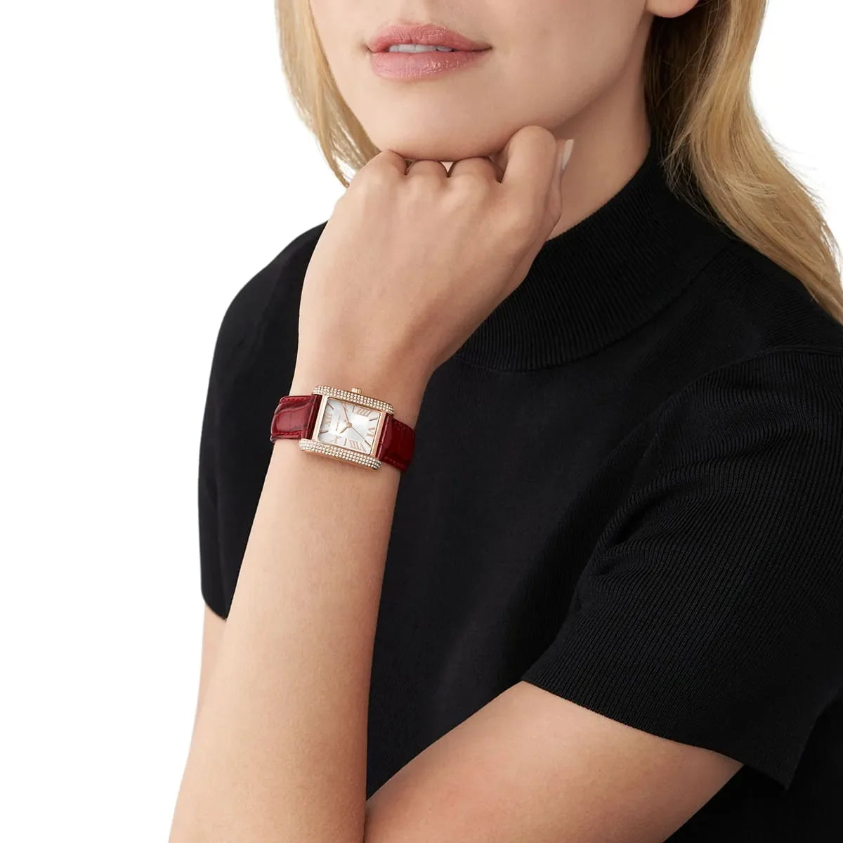 Michael Kors Emery watch worn on wrist, showing rectangular case and red leather strap