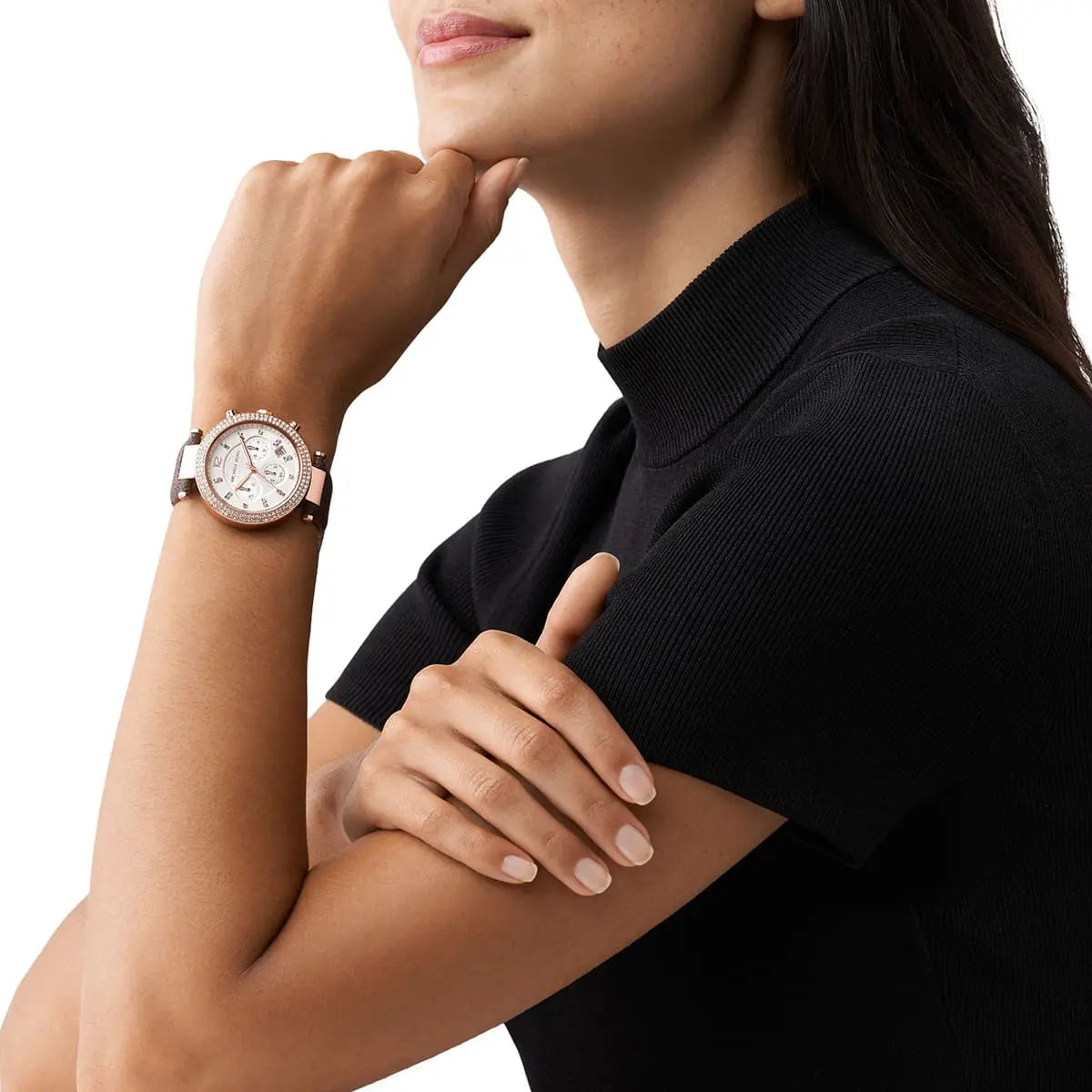 Michael Kors Parker Pavé chronograph watch worn on woman's wrist with rose gold case and brown strap
