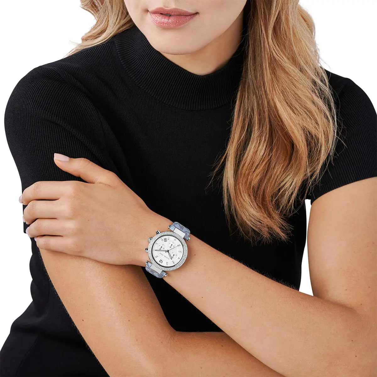 Michael Kors Parker chronograph watch worn on wrist with white dial and blue strap