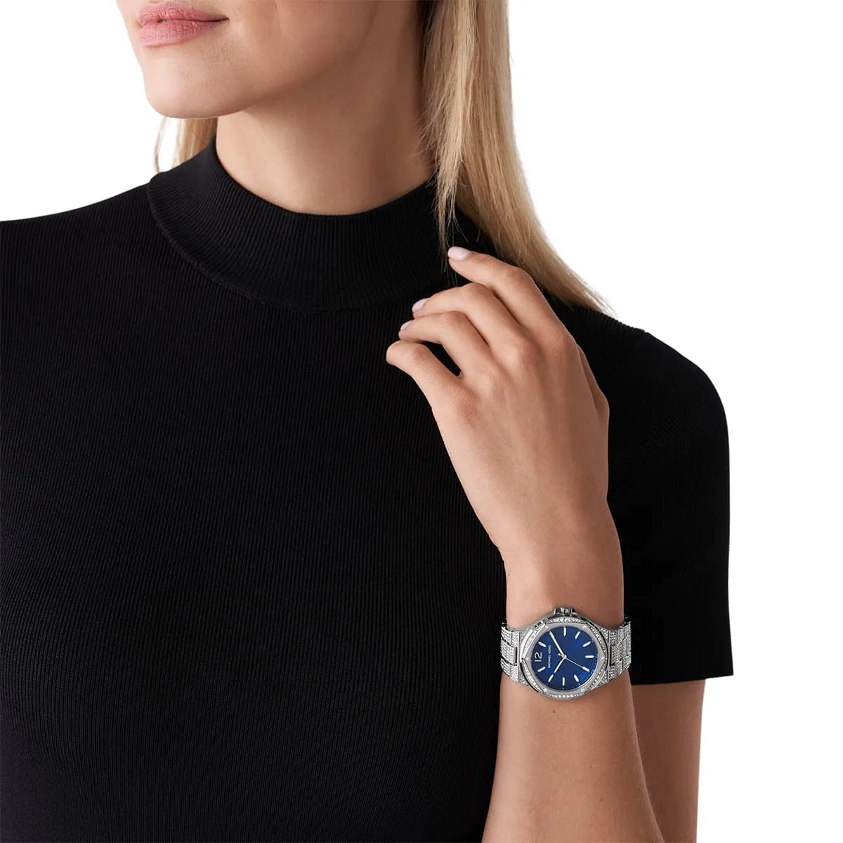 Michael Kors Lennox Pavé watch worn on wrist, showing blue dial and silver crystal-set bracelet