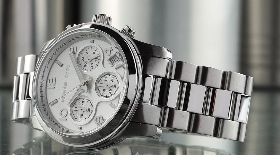Michael Kors MK7325 Runway Chronograph worn on wrist with white dial visible
