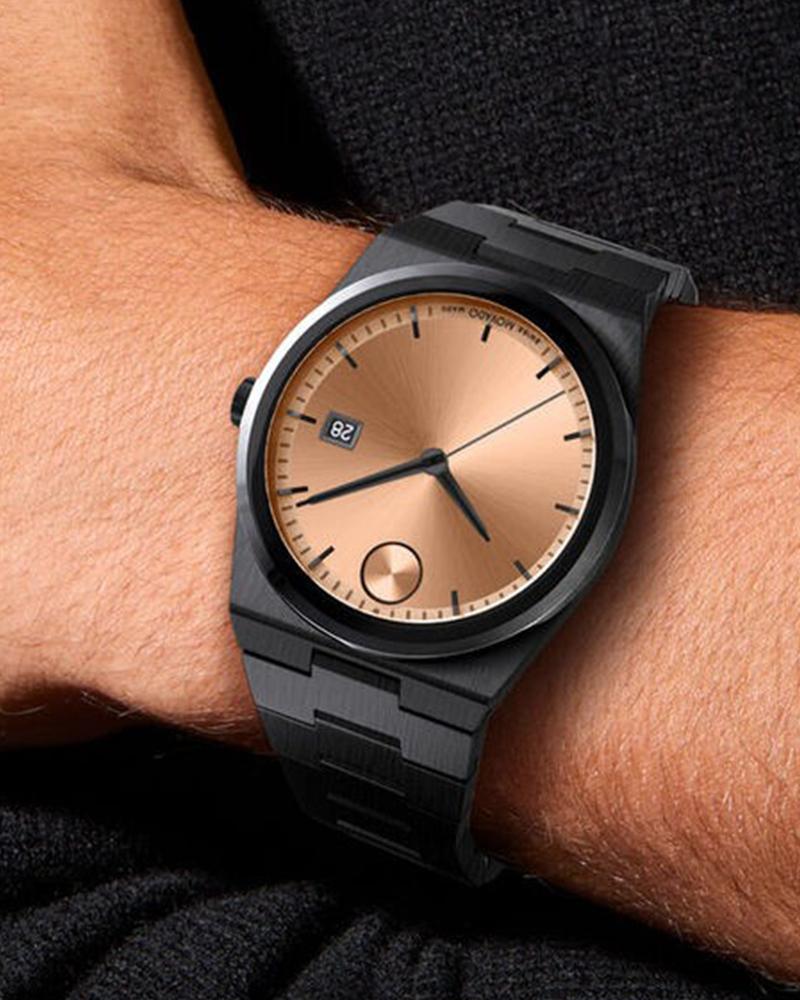 Movado Bold Quest watch worn on wrist showing rose gold dial and black case