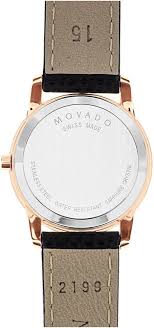 Movado Museum Classic caseback showing white dial backing, rose gold case, and leather strap tabs