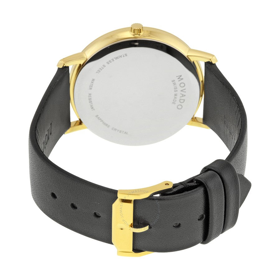 Caseback of Movado Sapphire watch showing gold-plated case and black leather strap attachment