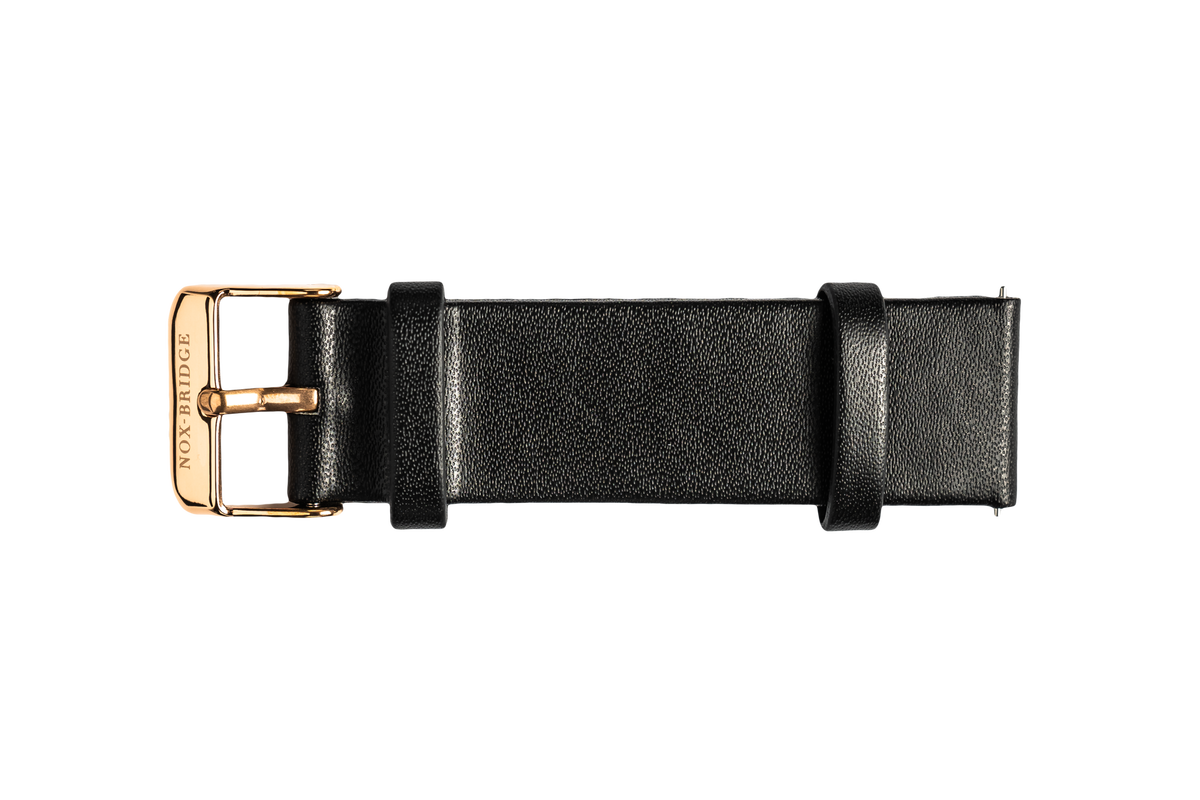 Black vegan leather strap with gold-tone metal buckle detail