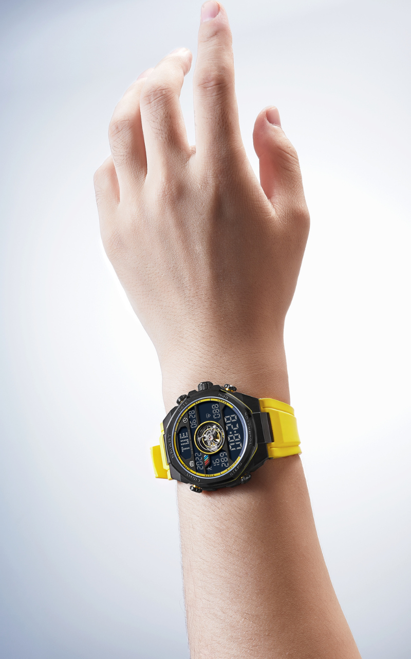 Noxbridge Skyway watch worn on wrist displaying yellow strap, black case, and digital dial with tourbillon