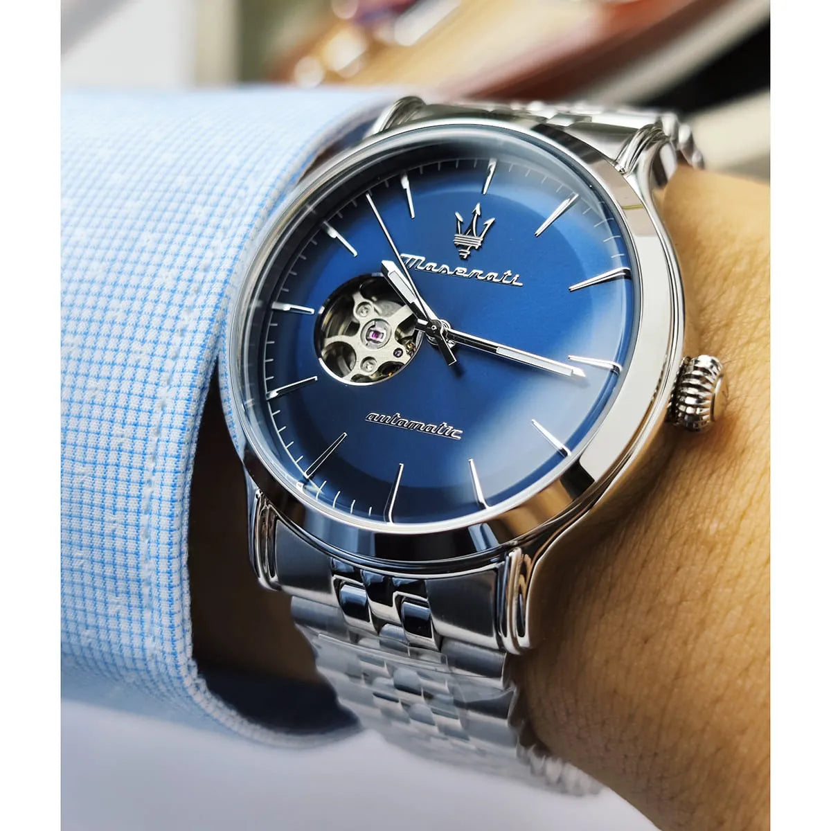 Maserati Epoca automatic watch worn on wrist showing blue dial and stainless steel bracelet