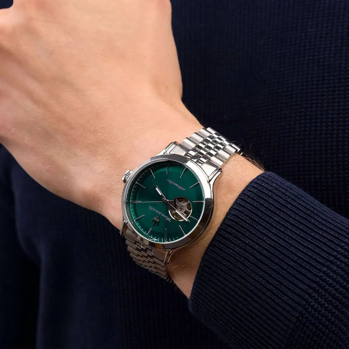 Maserati Epoca automatic watch worn on wrist showing green dial and stainless steel bracelet