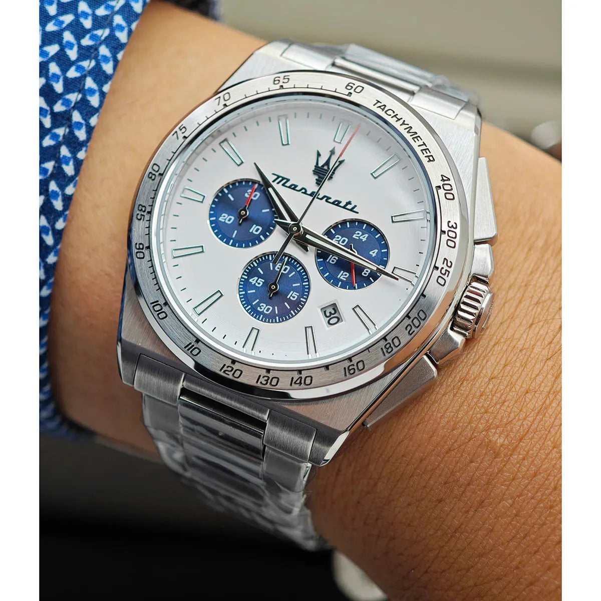 Maserati Velocità chronograph watch worn on wrist showing white dial and blue subdials