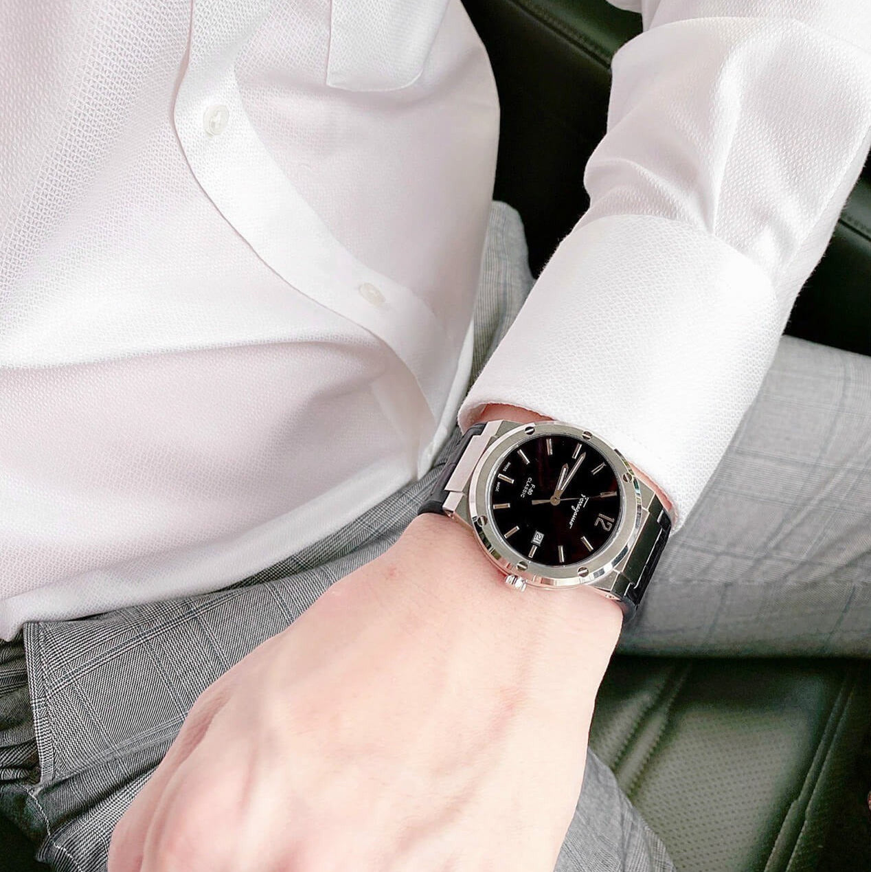 F-80 Classic black watch worn on wrist with white dress shirt sleeve