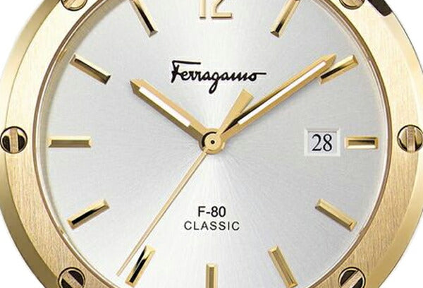 F-80 Classic dial close-up showing white face, gold indices, and date window at 3 o'clock
