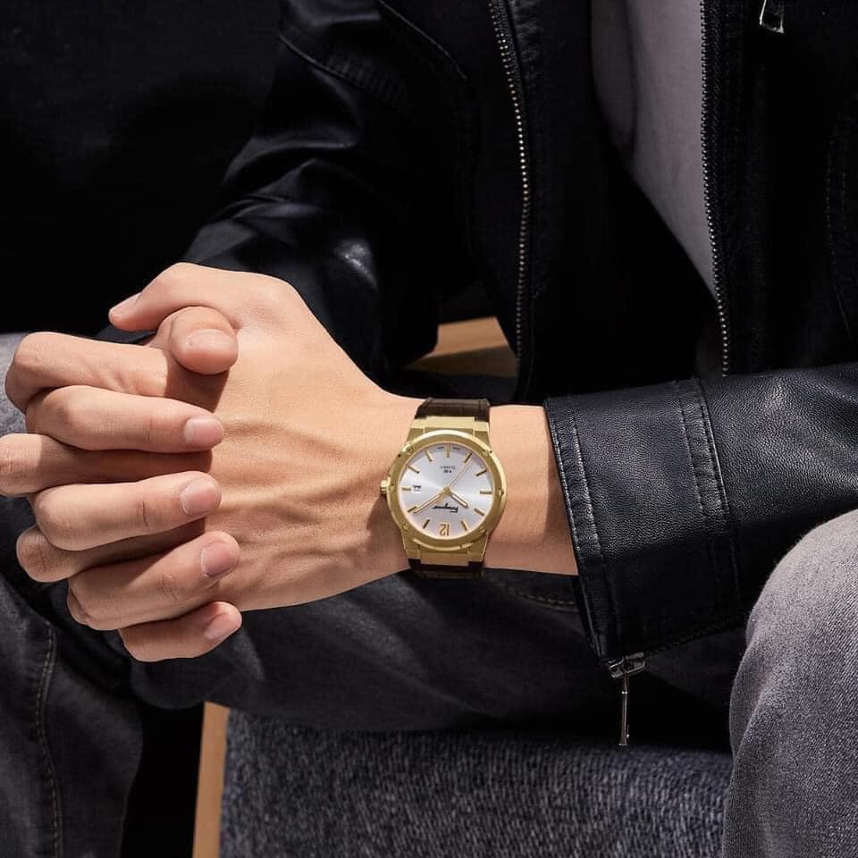 F-80 Classic watch on wrist styled with leather jacket, displaying white dial and gold case