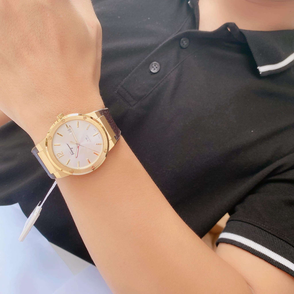 Salvatore Ferragamo F-80 Classic watch worn on wrist showing gold case and white dial