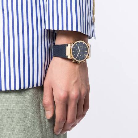 Salvatore Ferragamo Sapphire chronograph watch worn on wrist with blue strap