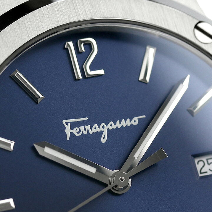 Close-up of Salvatore Ferragamo blue dial with silver hour markers and Ferragamo signature