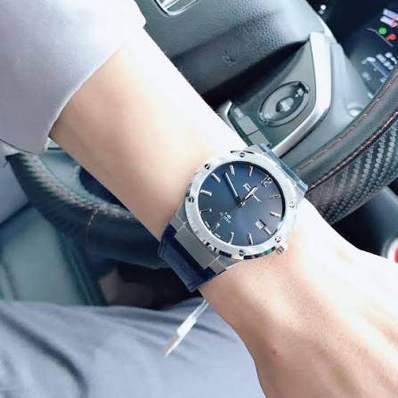 Salvatore Ferragamo SFDT00719 blue dial watch worn on wrist with navy fabric strap