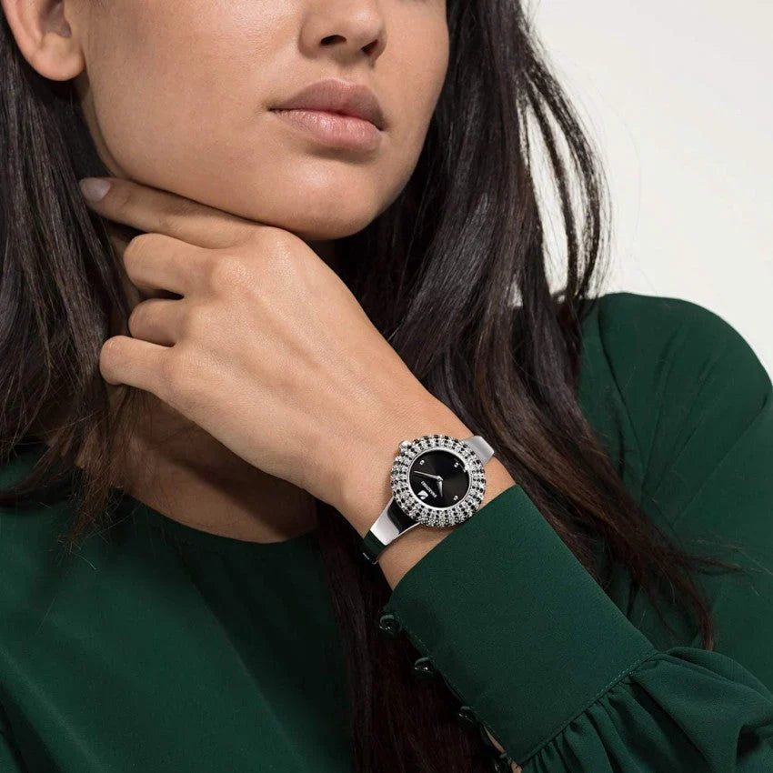Swarovski crystal watch worn on wrist with black dial and crystal bezel