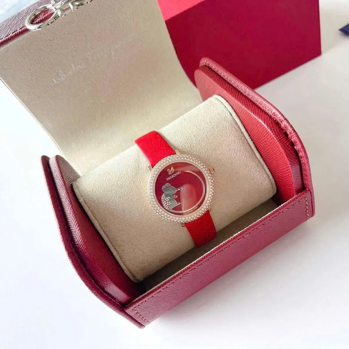 Swarovski Crystal Frost watch displayed in open red presentation box with white cushion