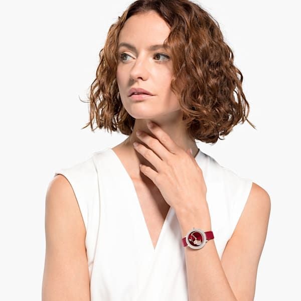 Swarovski Crystal Frost watch worn on wrist, showing red case and dial detail